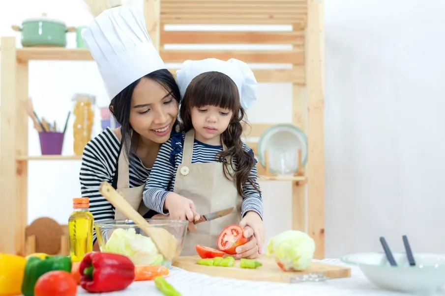 Mom and daughter cook