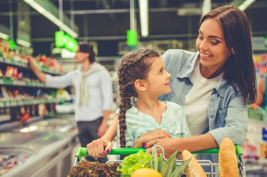 Woman with a child in a super market