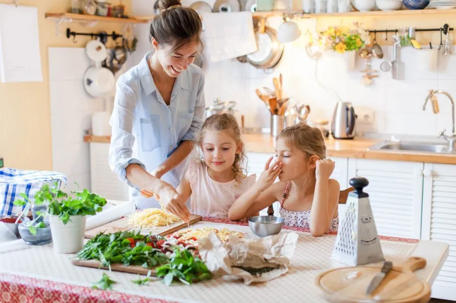Mom and daughters cook